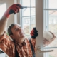 A worker installing energy efficient windows in Eastern IOWA