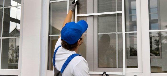Worker Replacing Windows of a house in Eastern Iowa